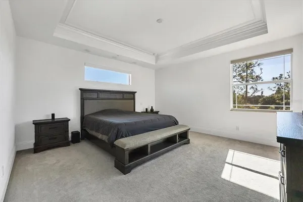 a view of a balcony with wooden floor and fence