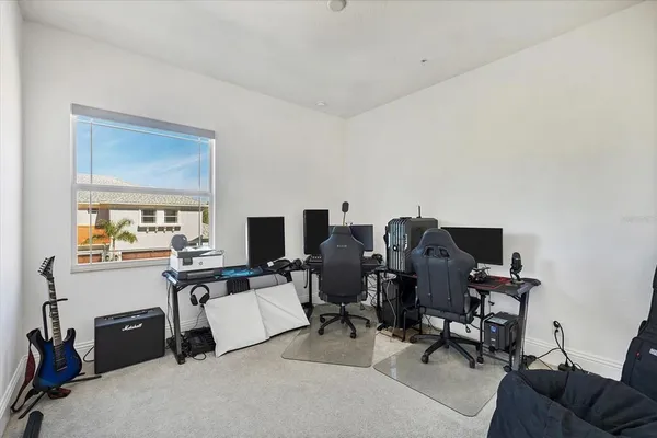 a view of a porch with furniture and garden