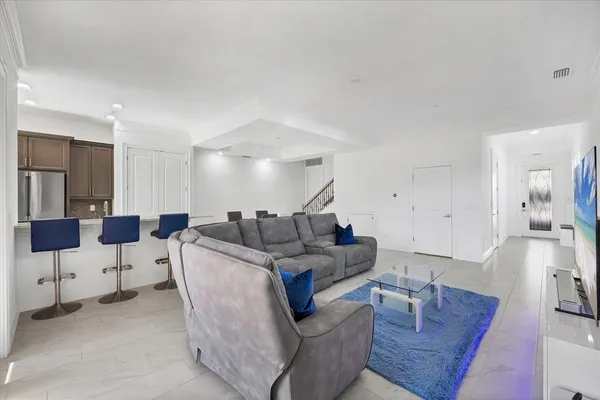 a living room with furniture and a table