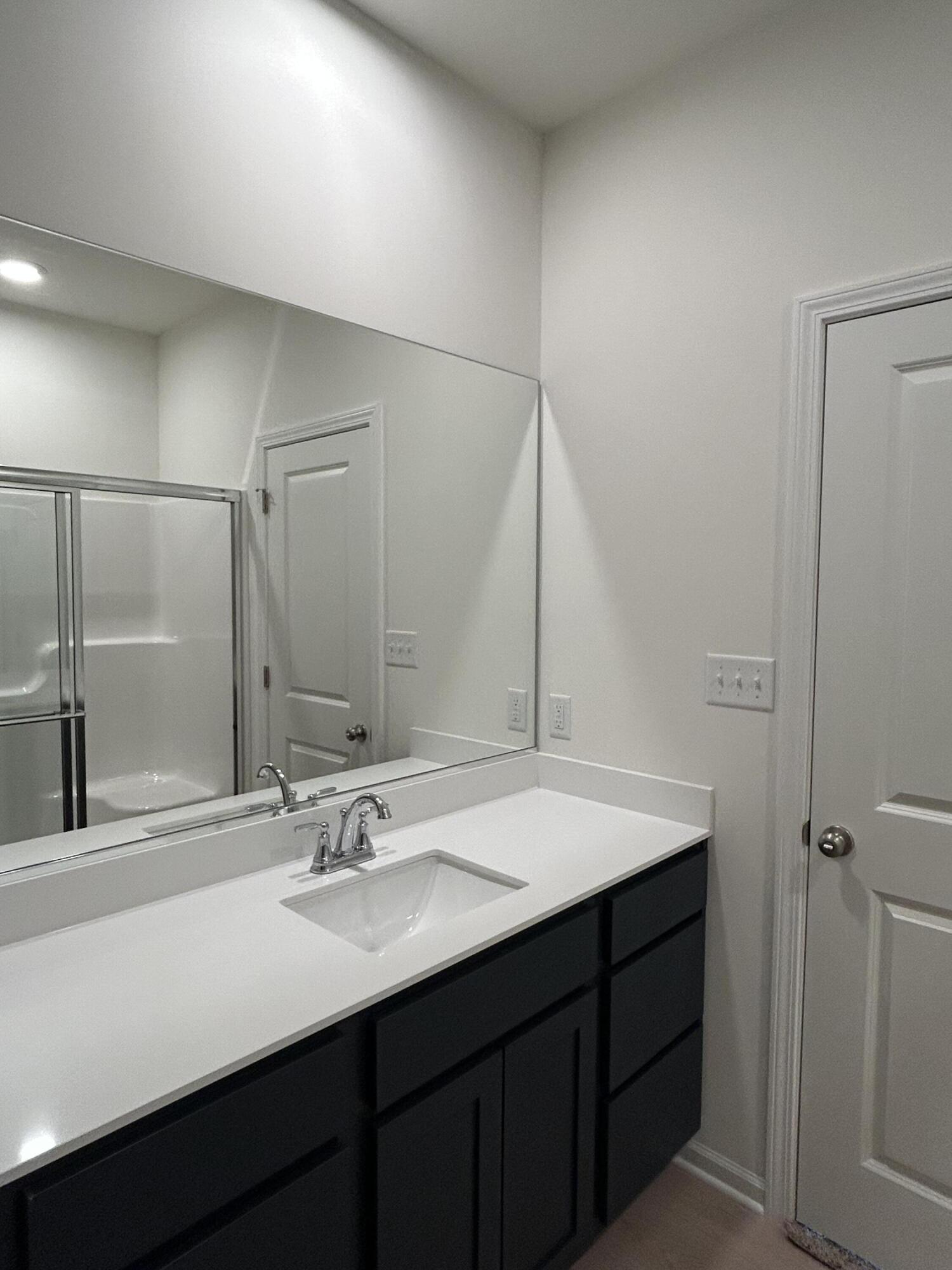 10373 Iowa Street Crown Point, IN 46307 - Photo 5 of 5 a bathroom with a sink and a mirror