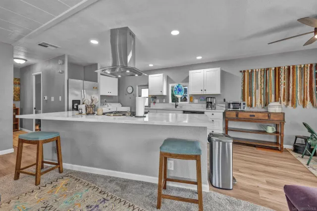 a workspace with wooden floor and windows