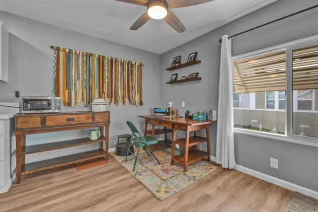 a kitchen with stove a sink and cabinets