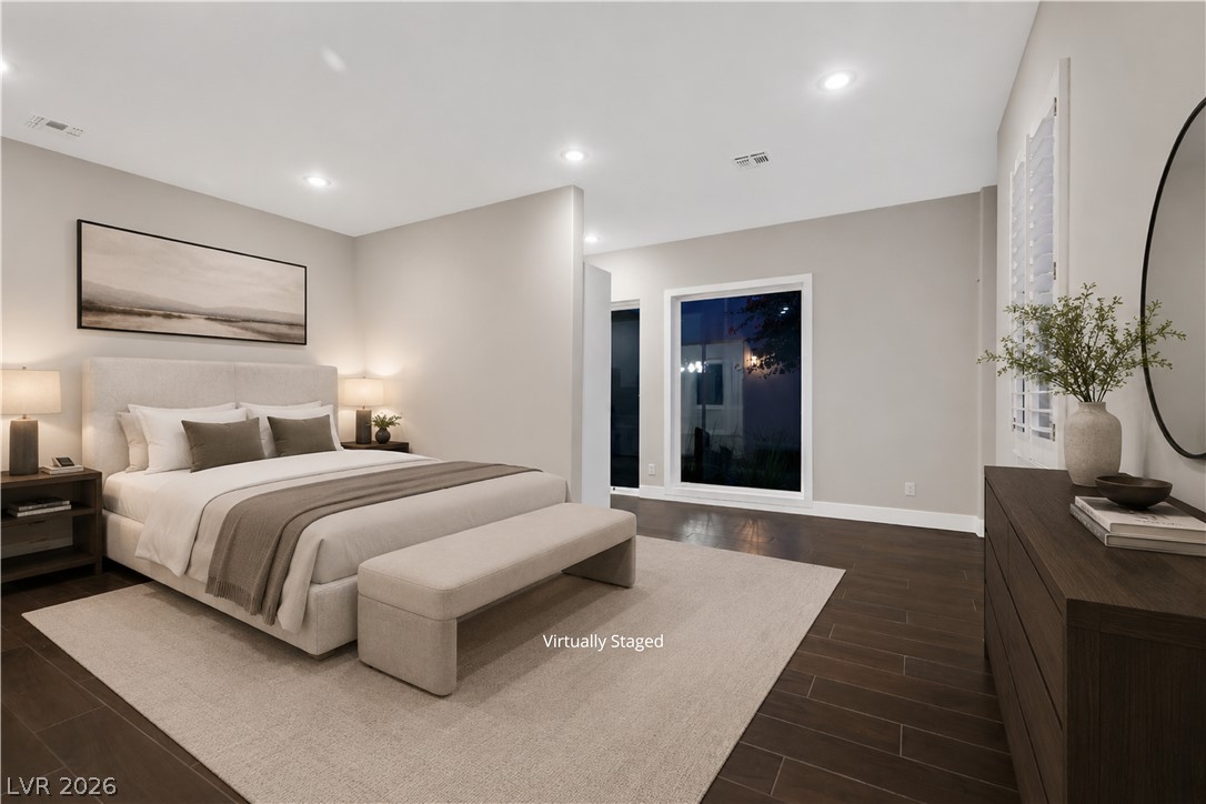6 Rue Du Ville Henderson, NV 89011 - Photo 14 of 99 “Virtually Staged” This tranquil sleeping area features clean lines and rich flooring, creating a serene personal retreat.