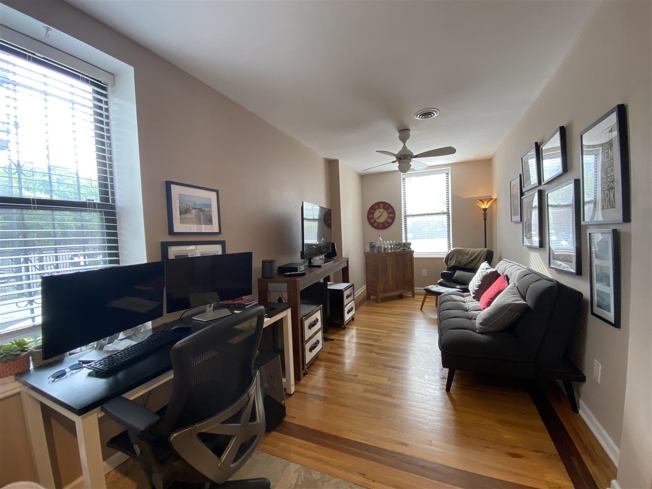 333 Monroe Street, Unit 1A Hoboken, NJ 07030 - Photo 1 of 15 a living room with furniture and wooden floor