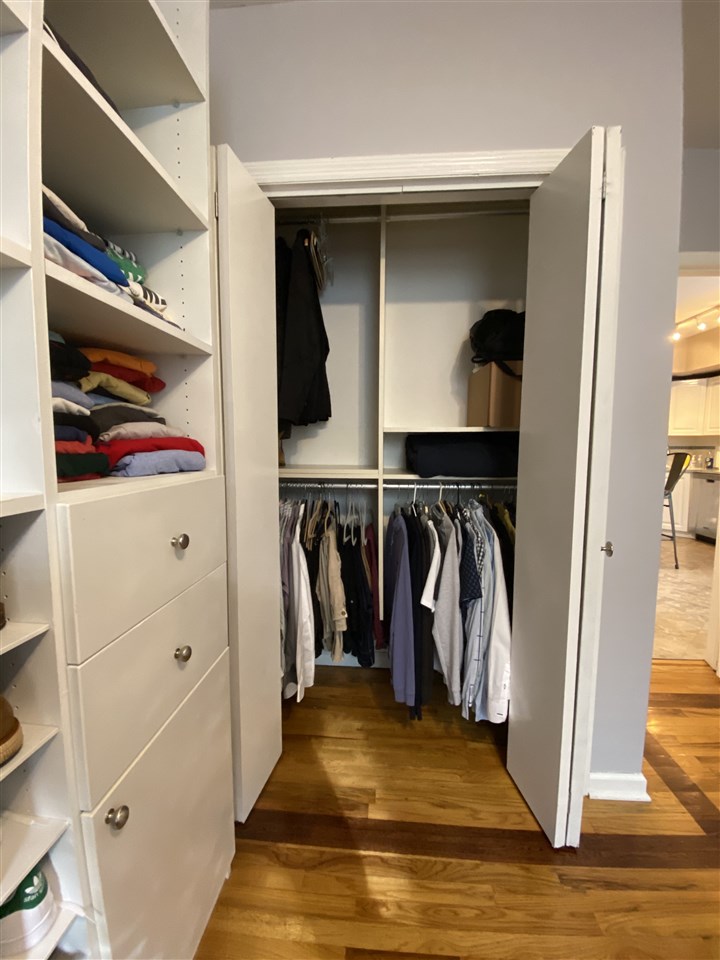 333 Monroe Street, Unit 1A Hoboken, NJ 07030 - Photo 12 of 15 a view of walk in closet with clothes and shoes