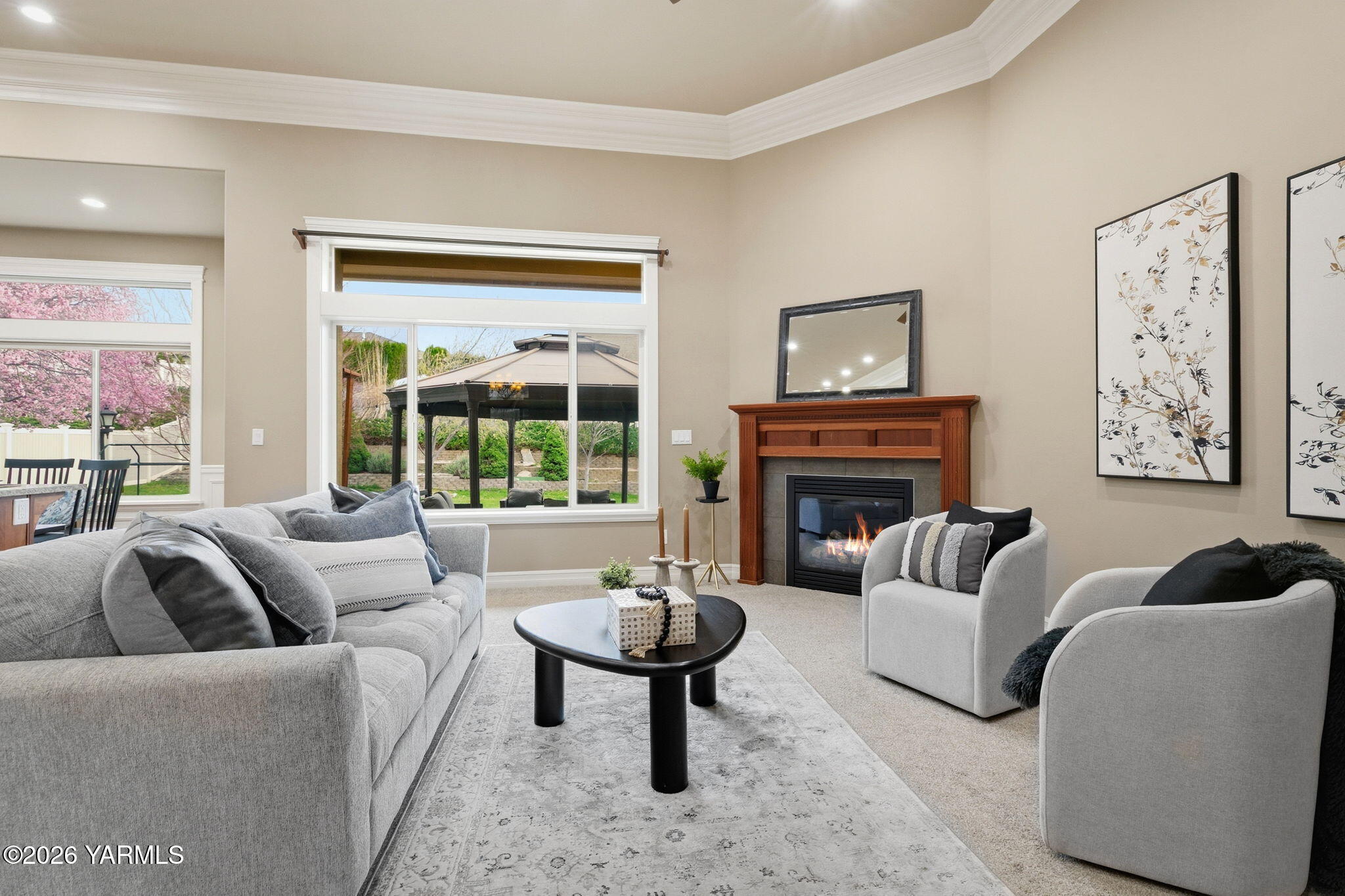 609 North 74th Avenue Yakima, WA 98908 - Photo 11 of 34 a living room with furniture fireplace and a large window