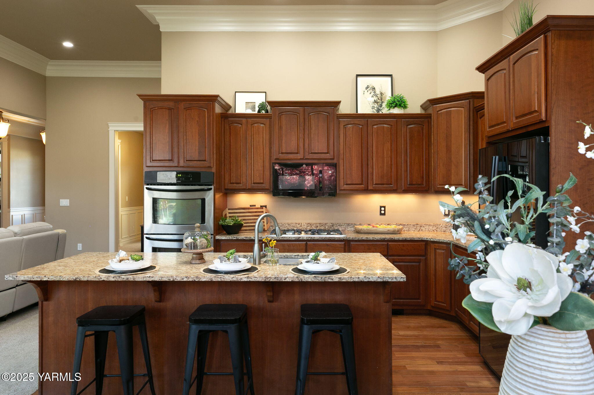 609 North 74th Avenue Yakima, WA 98908 - Photo 18 of 34 a kitchen with sink a refrigerator and wooden cabinets