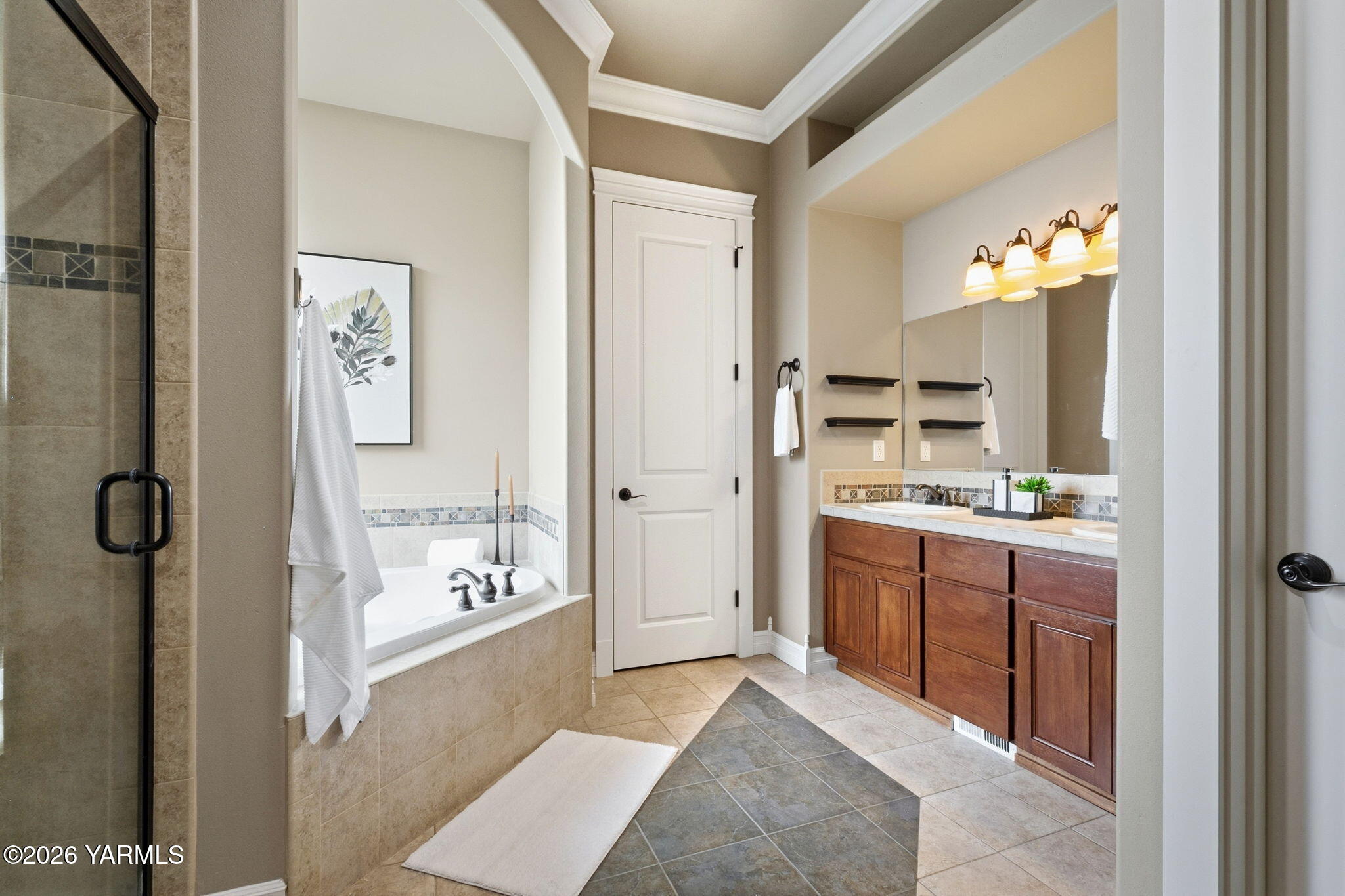 609 North 74th Avenue Yakima, WA 98908 - Photo 23 of 34 a spacious bathroom with a double vanity sink a mirror and a shower