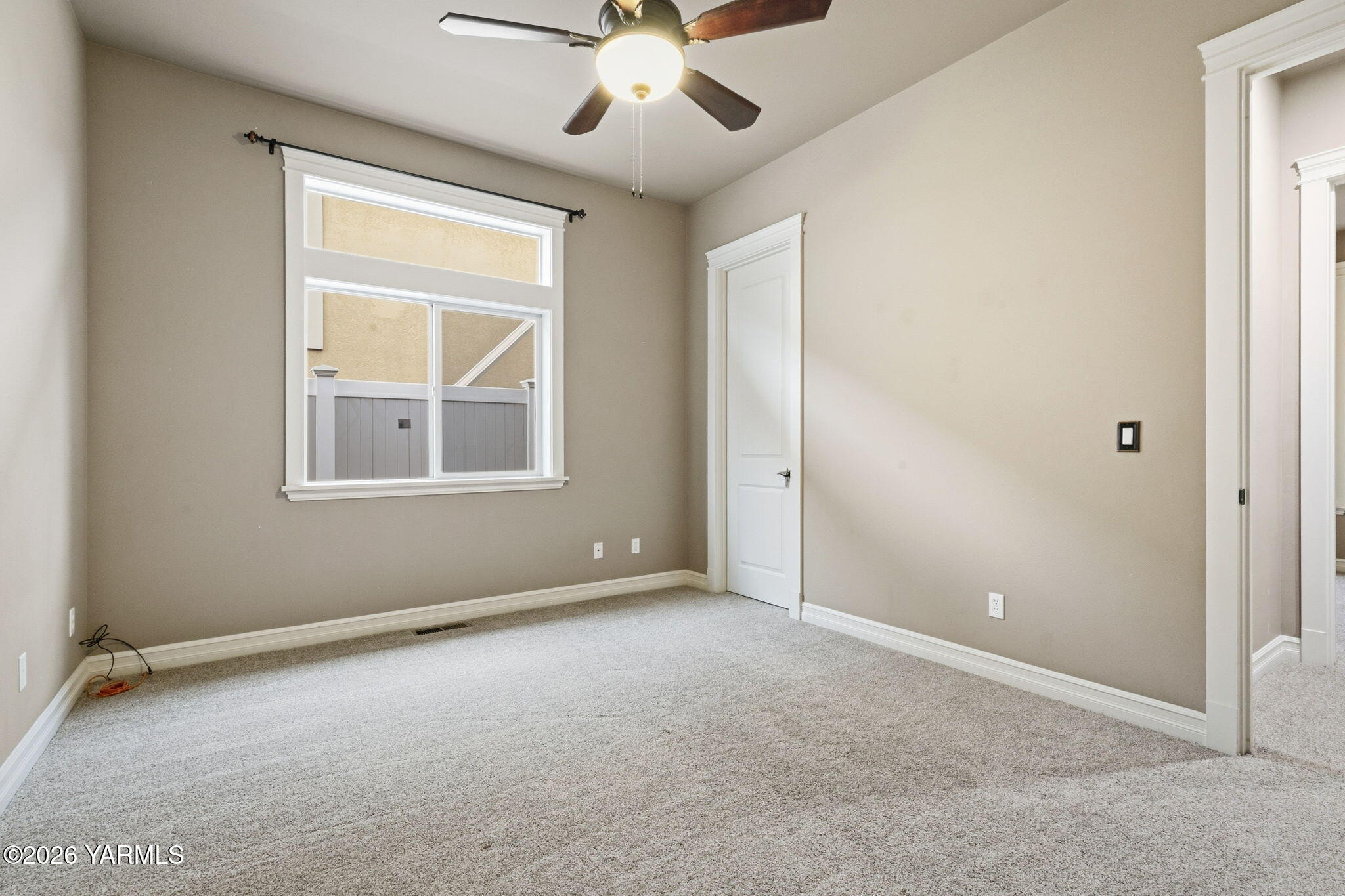 609 North 74th Avenue Yakima, WA 98908 - Photo 26 of 34 an empty room with windows and fan