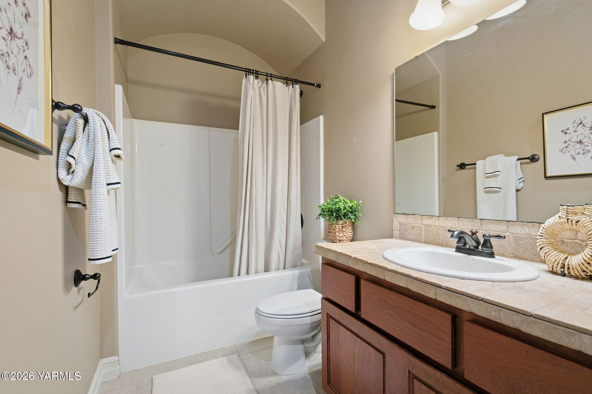 609 North 74th Avenue Yakima, WA 98908 - Photo 27 of 34 a bathroom with a granite countertop sink toilet and shower