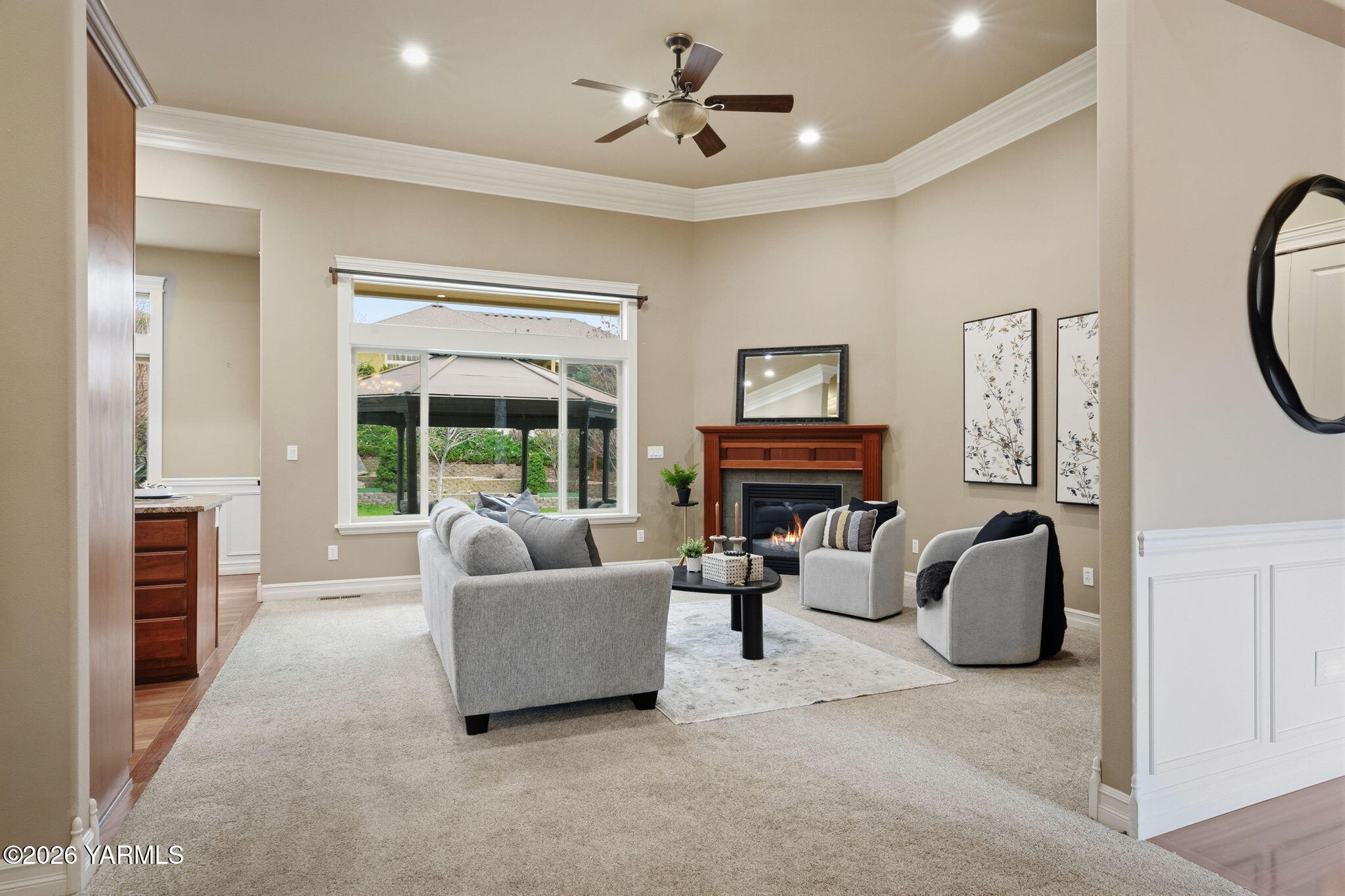 609 North 74th Avenue Yakima, WA 98908 - Photo 10 of 34 a living room with furniture a fireplace and a large window