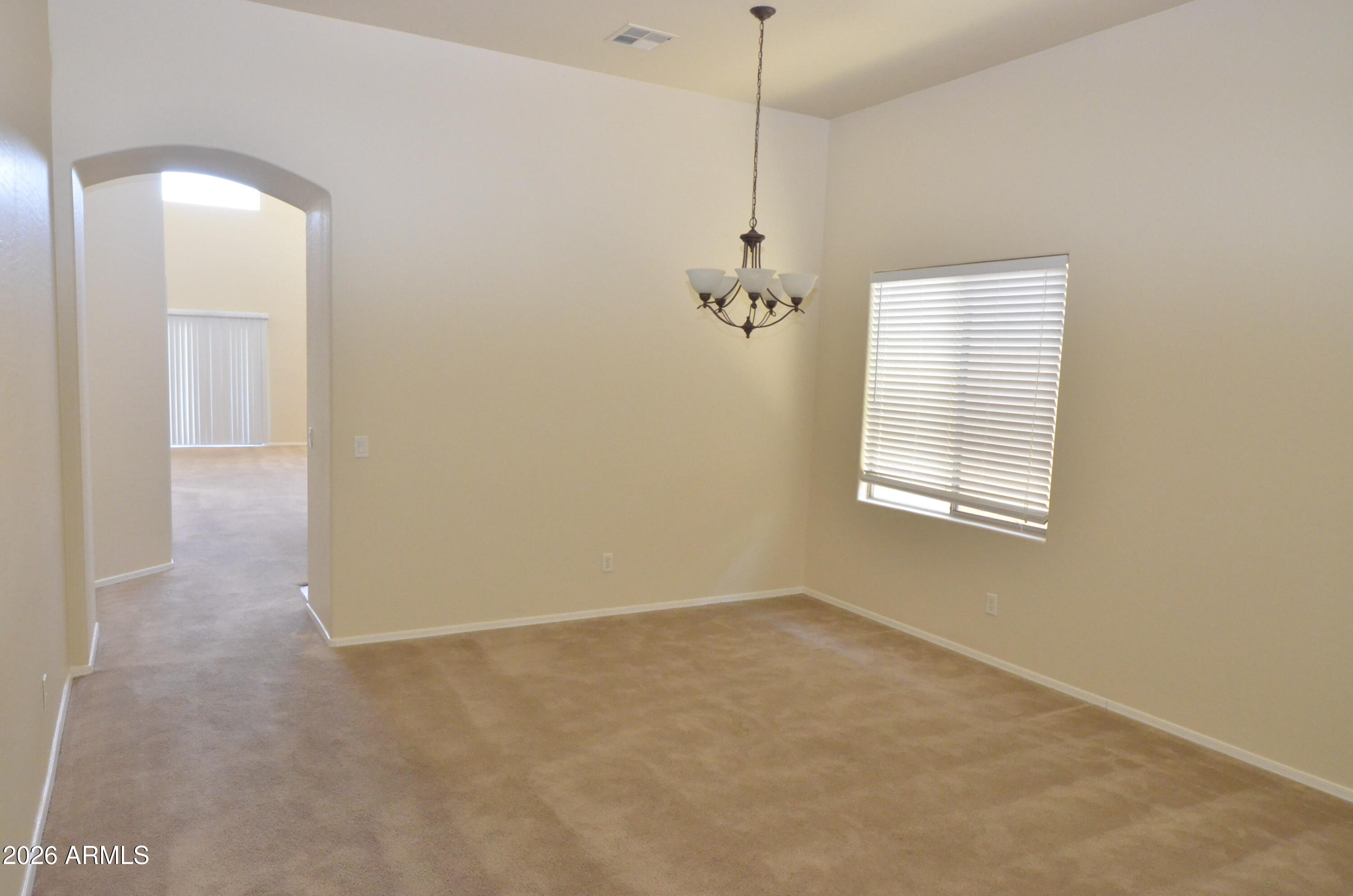 3995 East Trigger Way Gilbert, AZ 85297 - Photo 2 of 23 a view of an empty room with a window