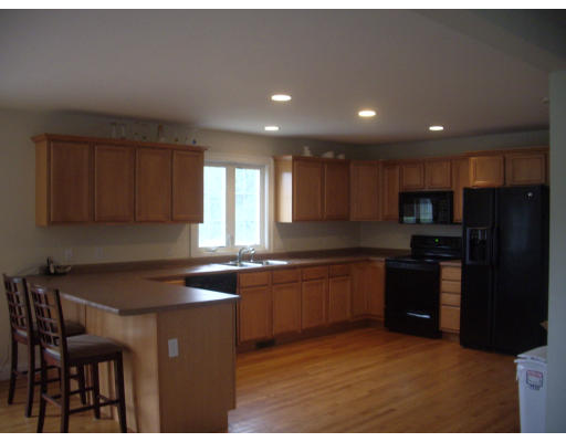 50 Mason Road Freetown, MA 02717 - Photo 1 of 4 a kitchen with granite countertop sink table and chairs