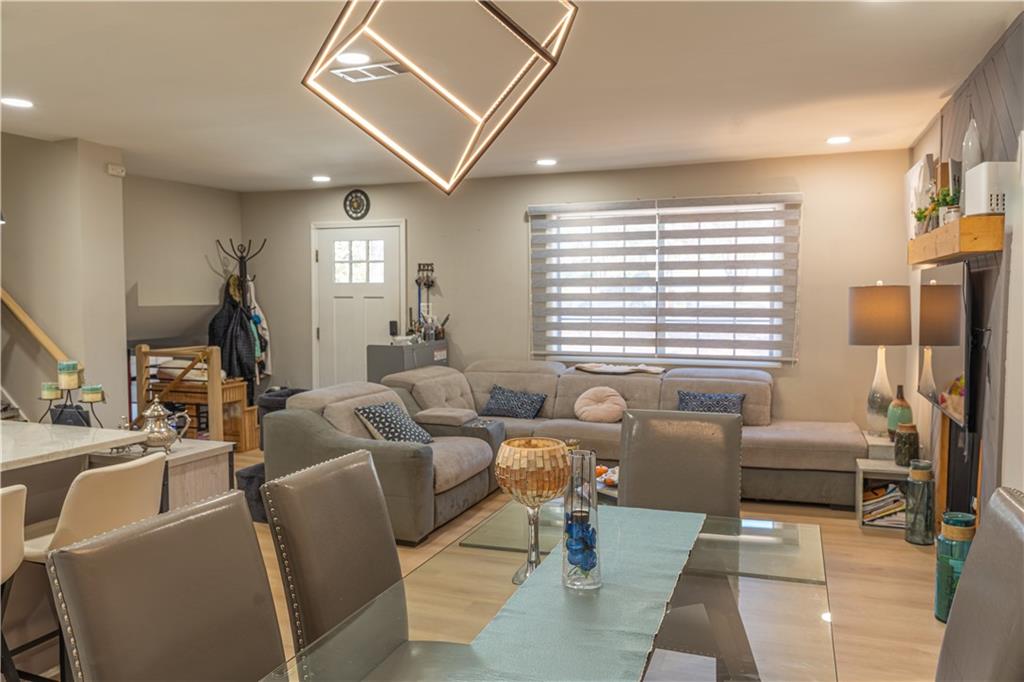 3316 Alcazar Drive Southwest Lilburn, GA 30047 - Photo 14 of 37 a living room with furniture and a large window