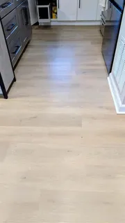 a bedroom with bed and a mirror