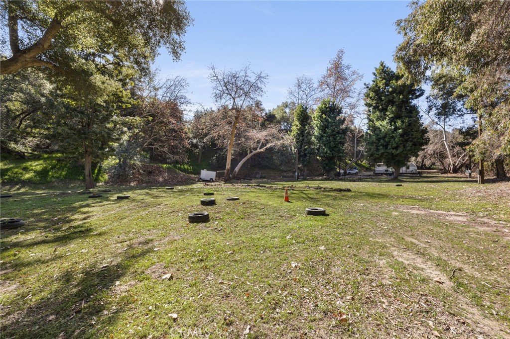 48980 De Luz Road Temecula, CA 92590 - Photo 20 of 50 a view of a pool with a yard