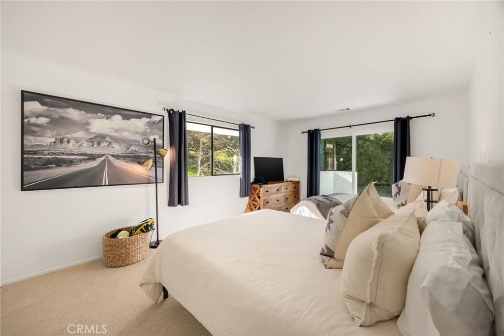 48980 De Luz Road Temecula, CA 92590 - Photo 24 of 50 a bedroom with a bed and large window