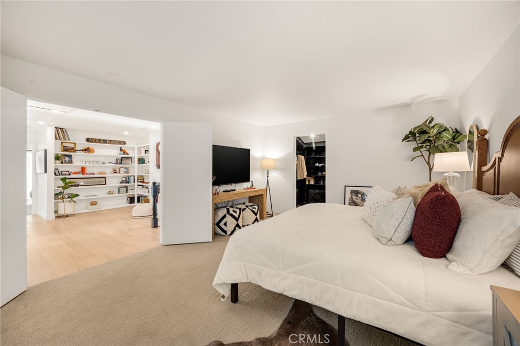 48980 De Luz Road Temecula, CA 92590 - Photo 33 of 50 a bedroom with a bed and a flat screen tv