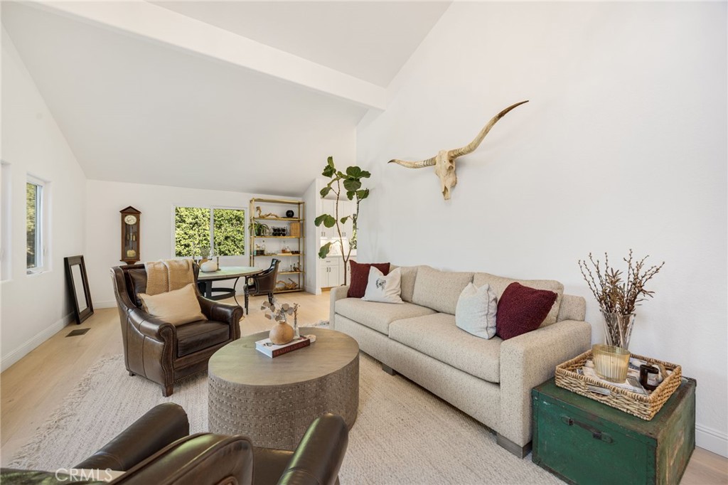 48980 De Luz Road Temecula, CA 92590 - Photo 8 of 50 a living room with furniture potted plant and a window