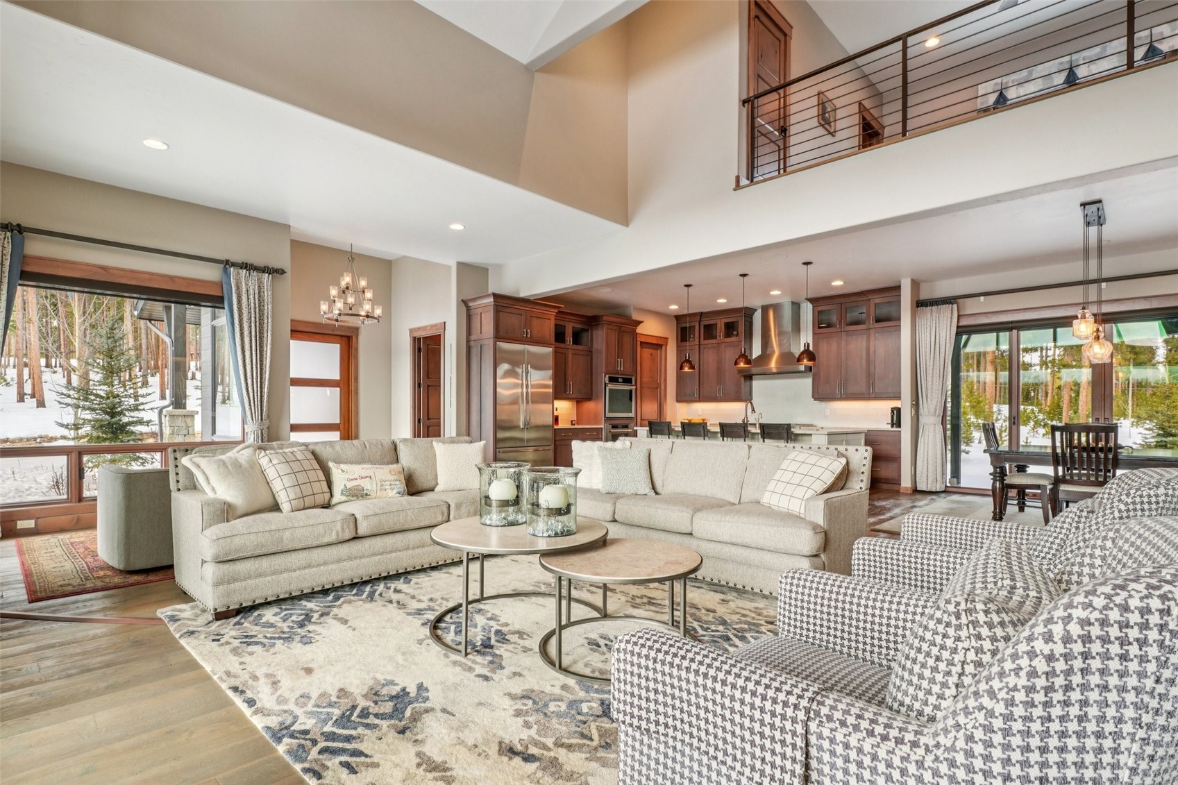 60 Barton Ridge Drive Breckenridge, CO 80424 - Photo 13 of 50 Living room featuring hanging lights, a high ceiling, and wood finished floors