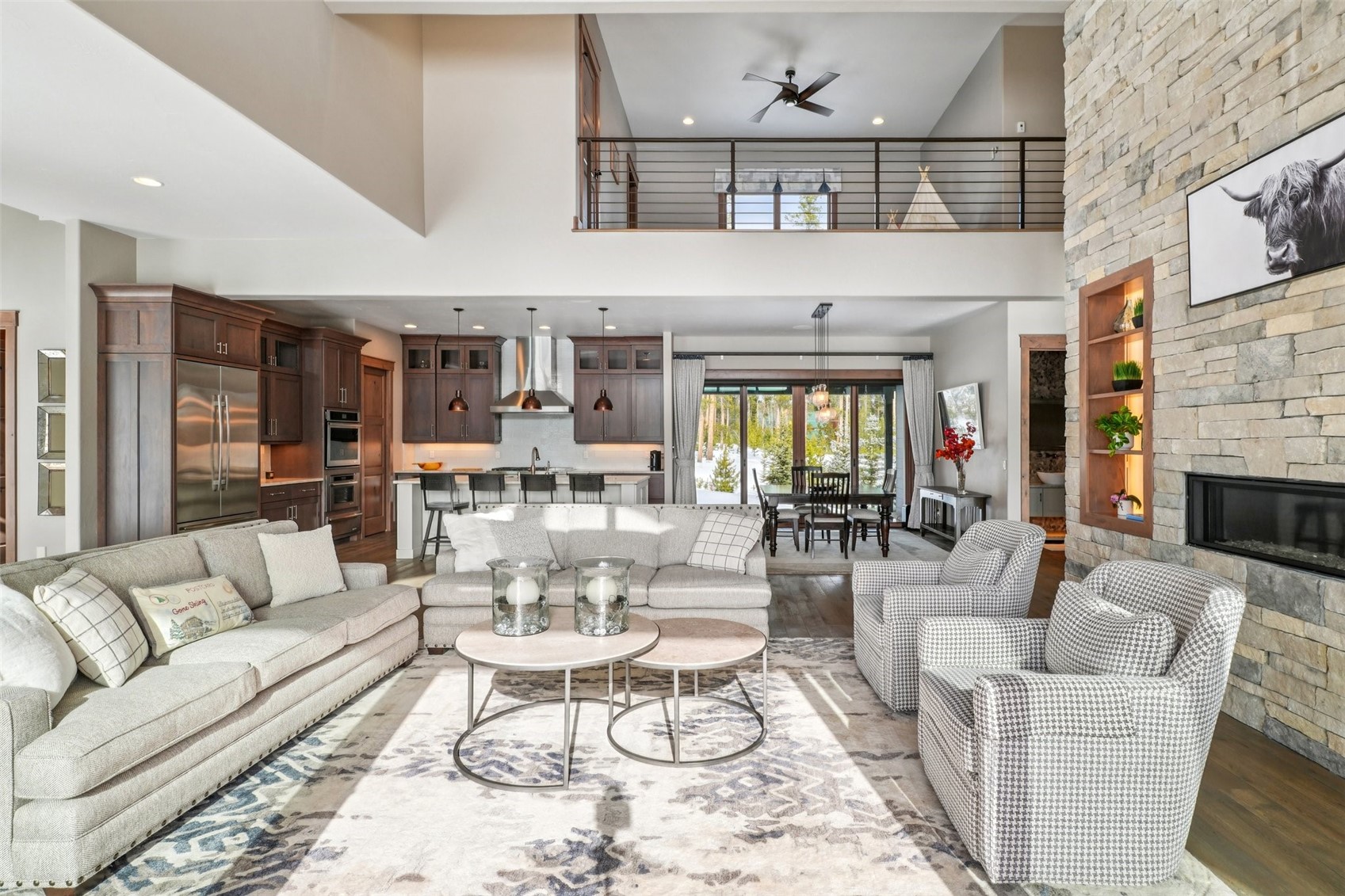 60 Barton Ridge Drive Breckenridge, CO 80424 - Photo 14 of 50 Living area featuring ceiling fan, a fireplace, wood finished floors, a high ceiling, and recessed lighting