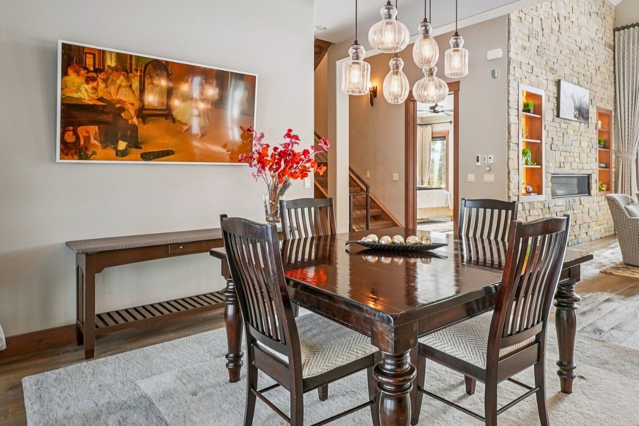 60 Barton Ridge Drive Breckenridge, CO 80424 - Photo 16 of 50 Dining space featuring wood finished floors and a fireplace