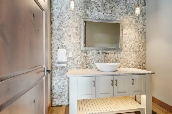 a bathroom with a bathtub and shower