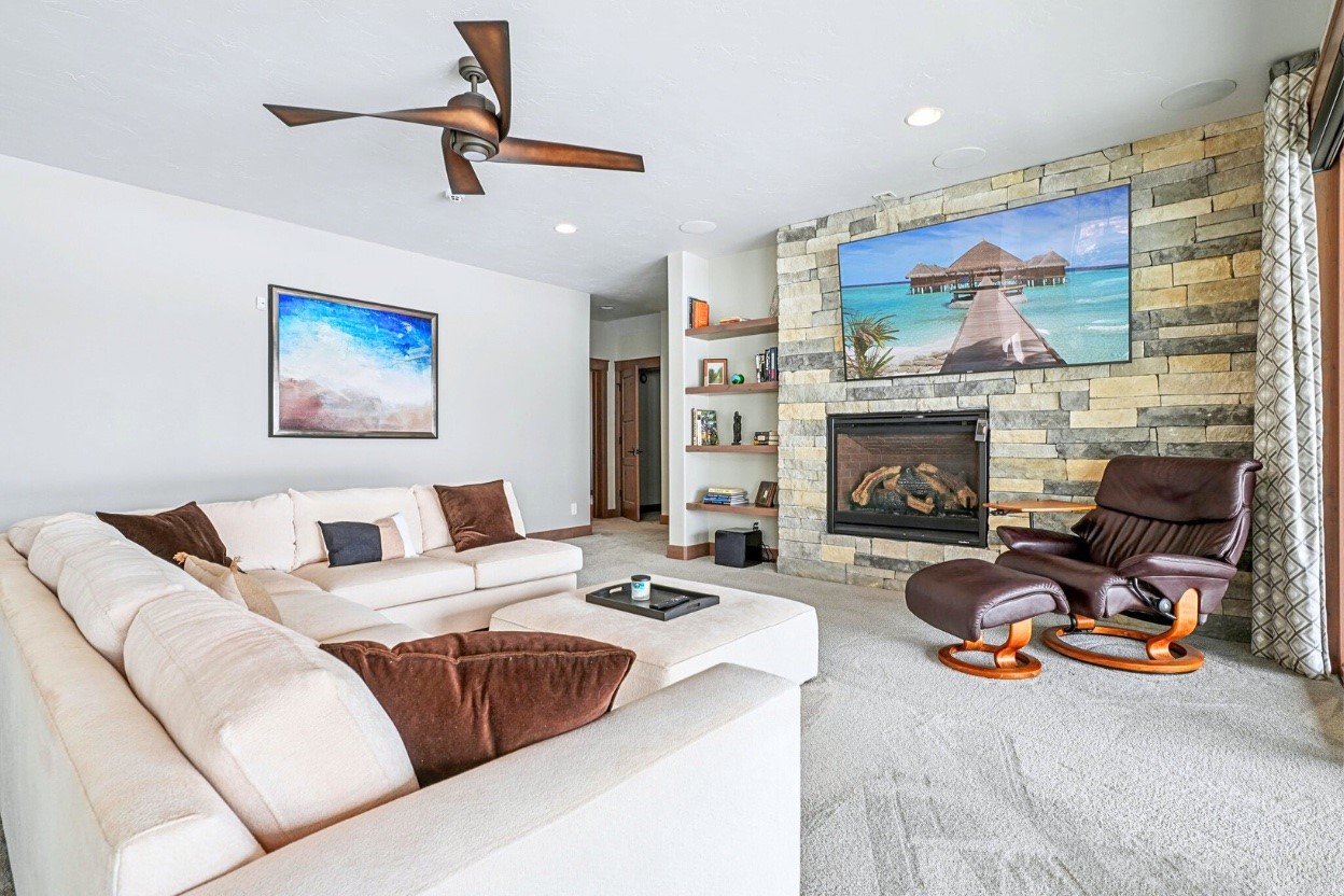 60 Barton Ridge Drive Breckenridge, CO 80424 - Photo 25 of 50 a living room with furniture a fireplace and a flat screen tv
