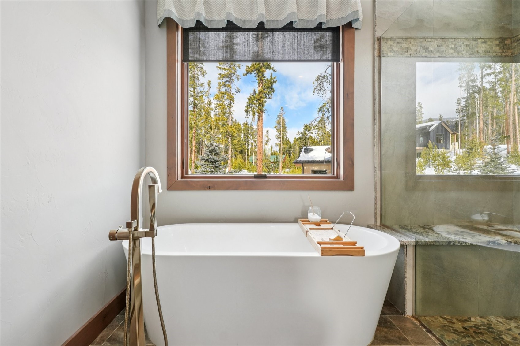 60 Barton Ridge Drive Breckenridge, CO 80424 - Photo 26 of 50 Full bathroom with a freestanding bath and dark stone finish floors