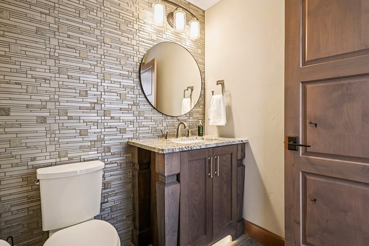 60 Barton Ridge Drive Breckenridge, CO 80424 - Photo 27 of 50 a bathroom with a granite countertop toilet sink and mirror
