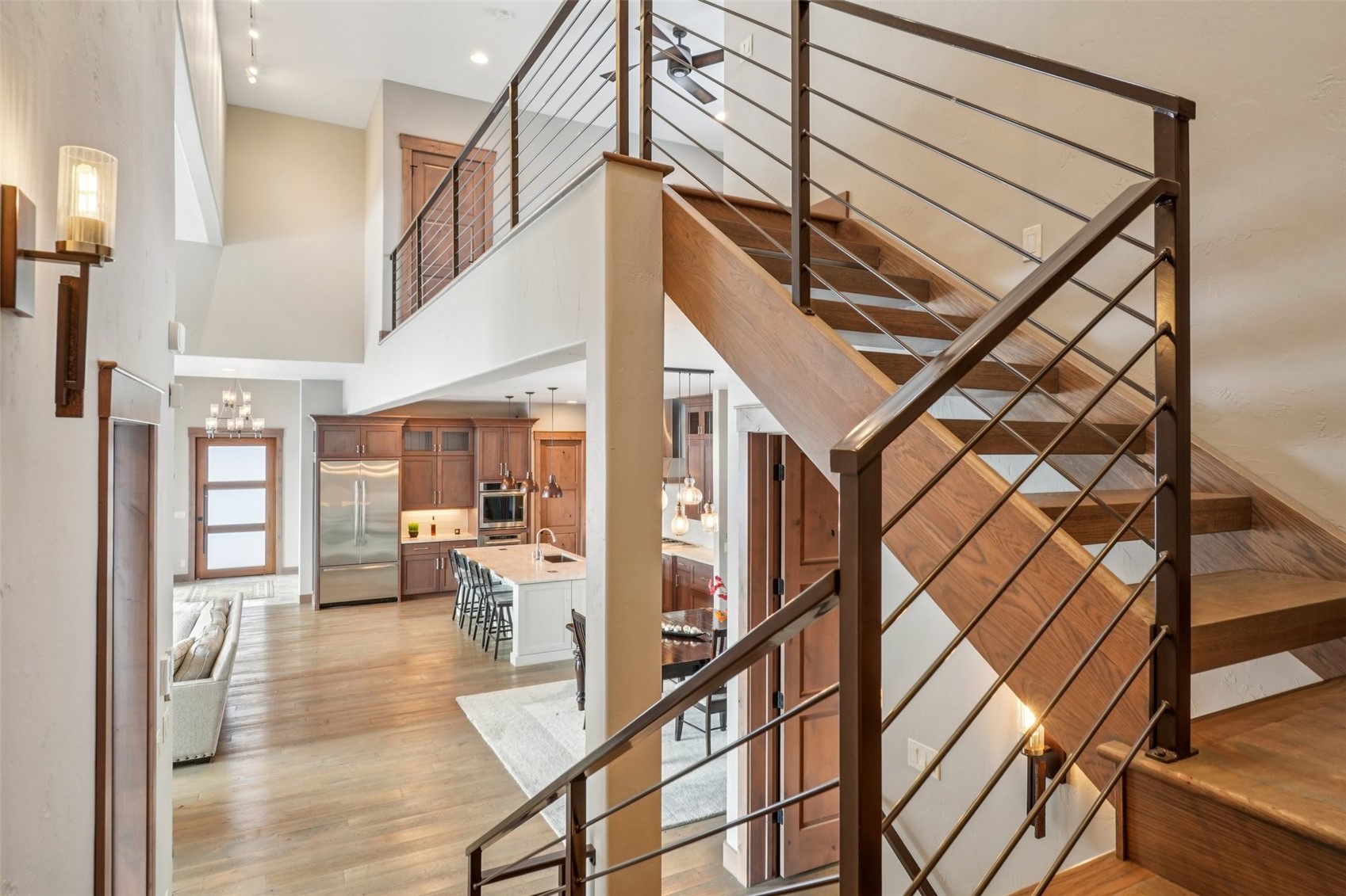 60 Barton Ridge Drive Breckenridge, CO 80424 - Photo 29 of 50 Stairs with suspended lighting, wood finished floors, and a high ceiling