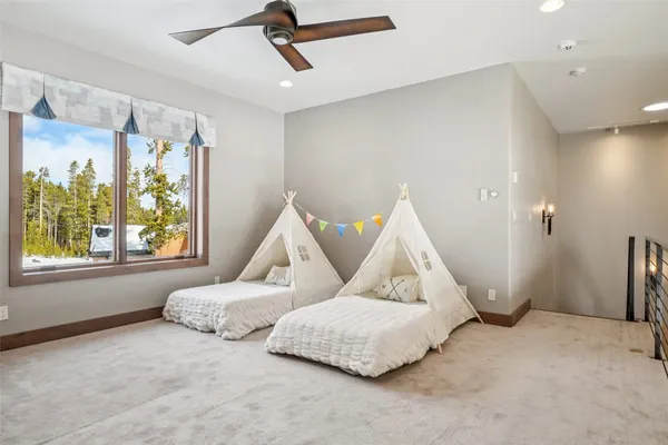 a bedroom with furniture and a window