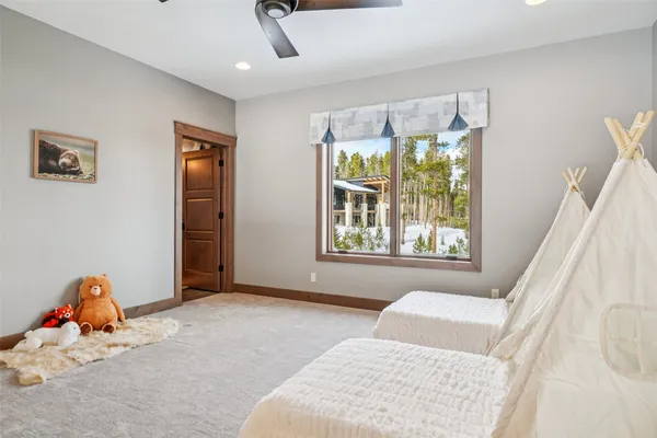 a bathroom with a sink toilet vanity and shower