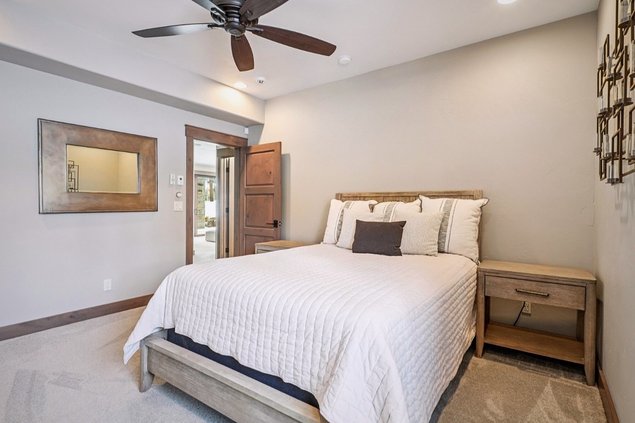 60 Barton Ridge Drive Breckenridge, CO 80424 - Photo 32 of 50 a bedroom with a bed and ceiling fan