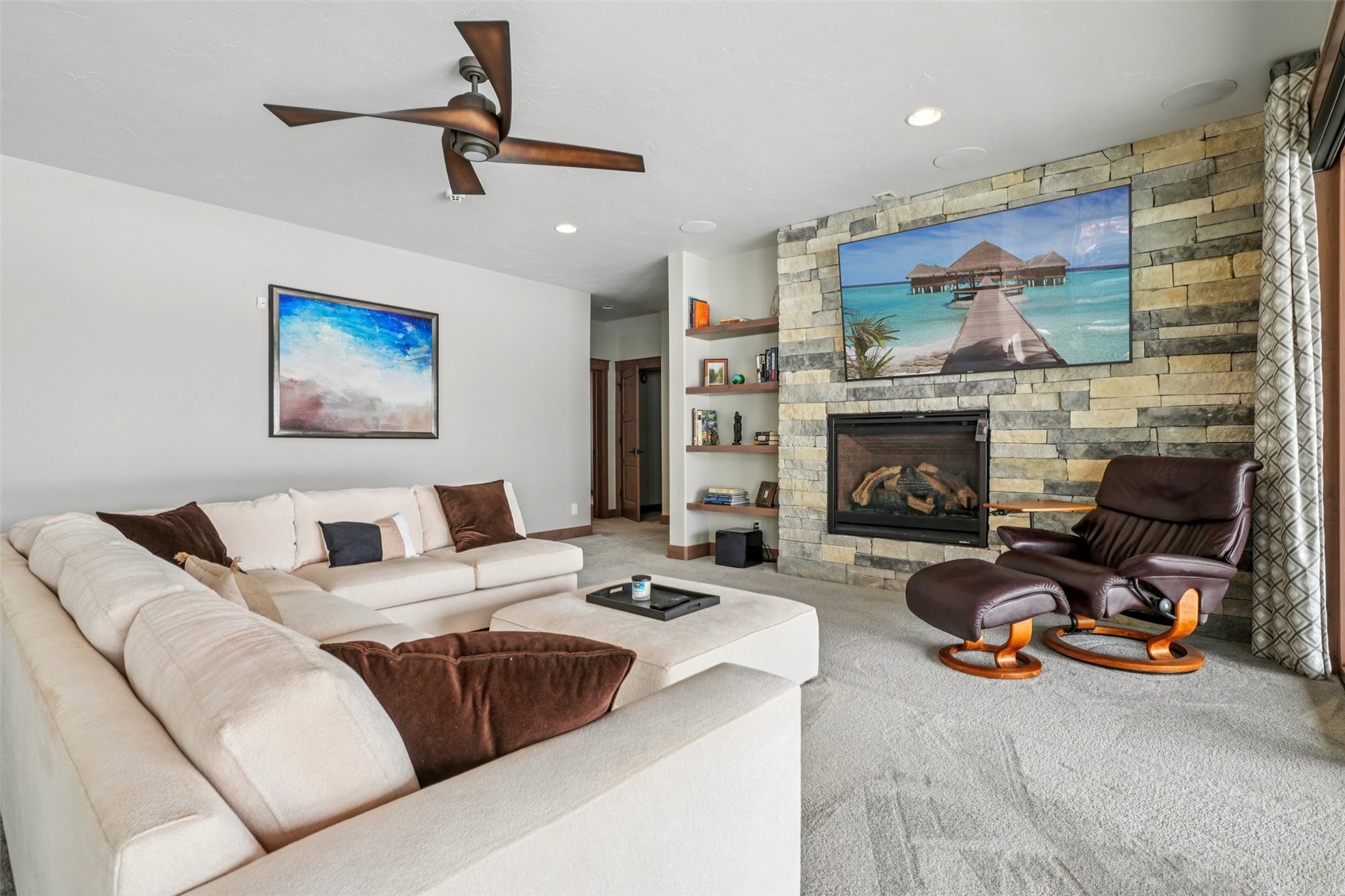 60 Barton Ridge Drive Breckenridge, CO 80424 - Photo 36 of 50 Carpeted living area featuring a stone fireplace, ceiling fan, and recessed lighting