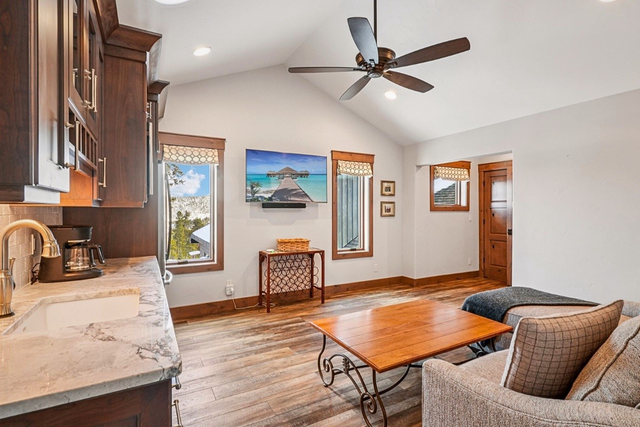 60 Barton Ridge Drive Breckenridge, CO 80424 - Photo 38 of 50 a living room with furniture and a wooden floor