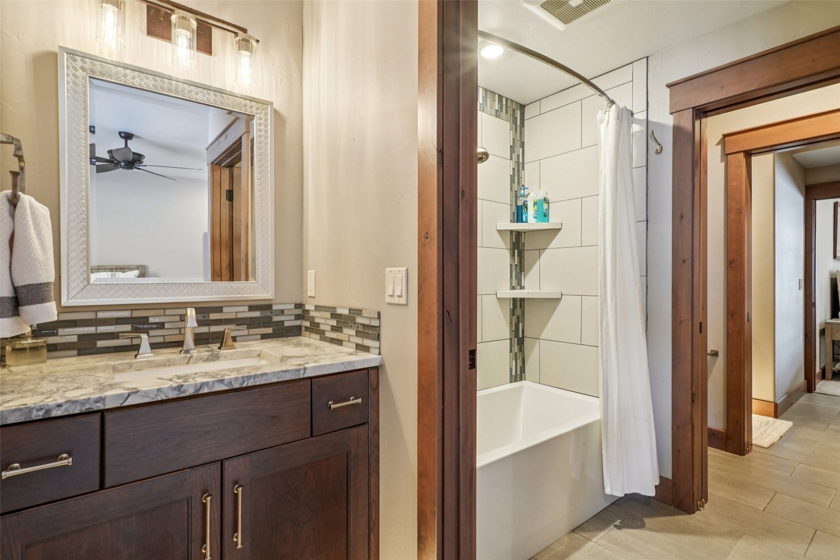 60 Barton Ridge Drive Breckenridge, CO 80424 - Photo 42 of 50 Full bathroom featuring shower / tub combo with curtain, vanity, tasteful backsplash, and a ceiling fan