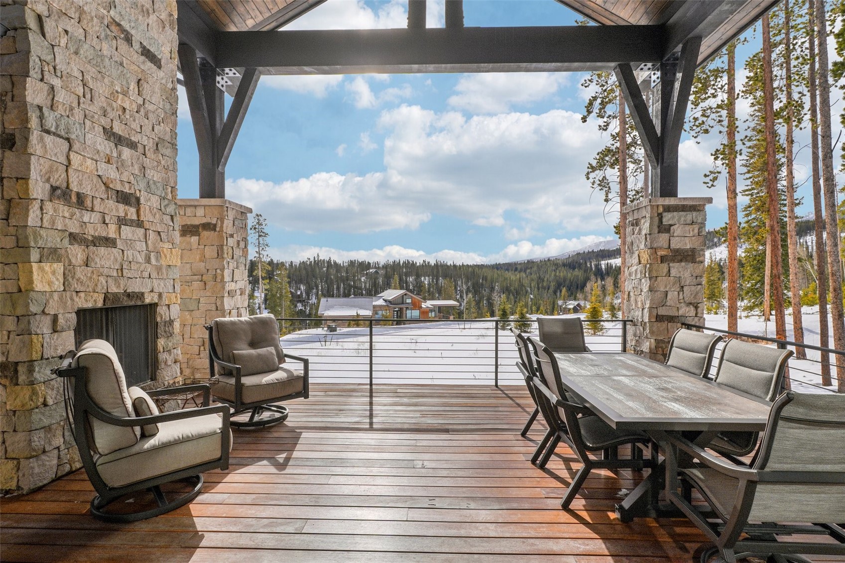 60 Barton Ridge Drive Breckenridge, CO 80424 - Photo 8 of 50 Wooden terrace featuring outdoor dining area and a wooded view