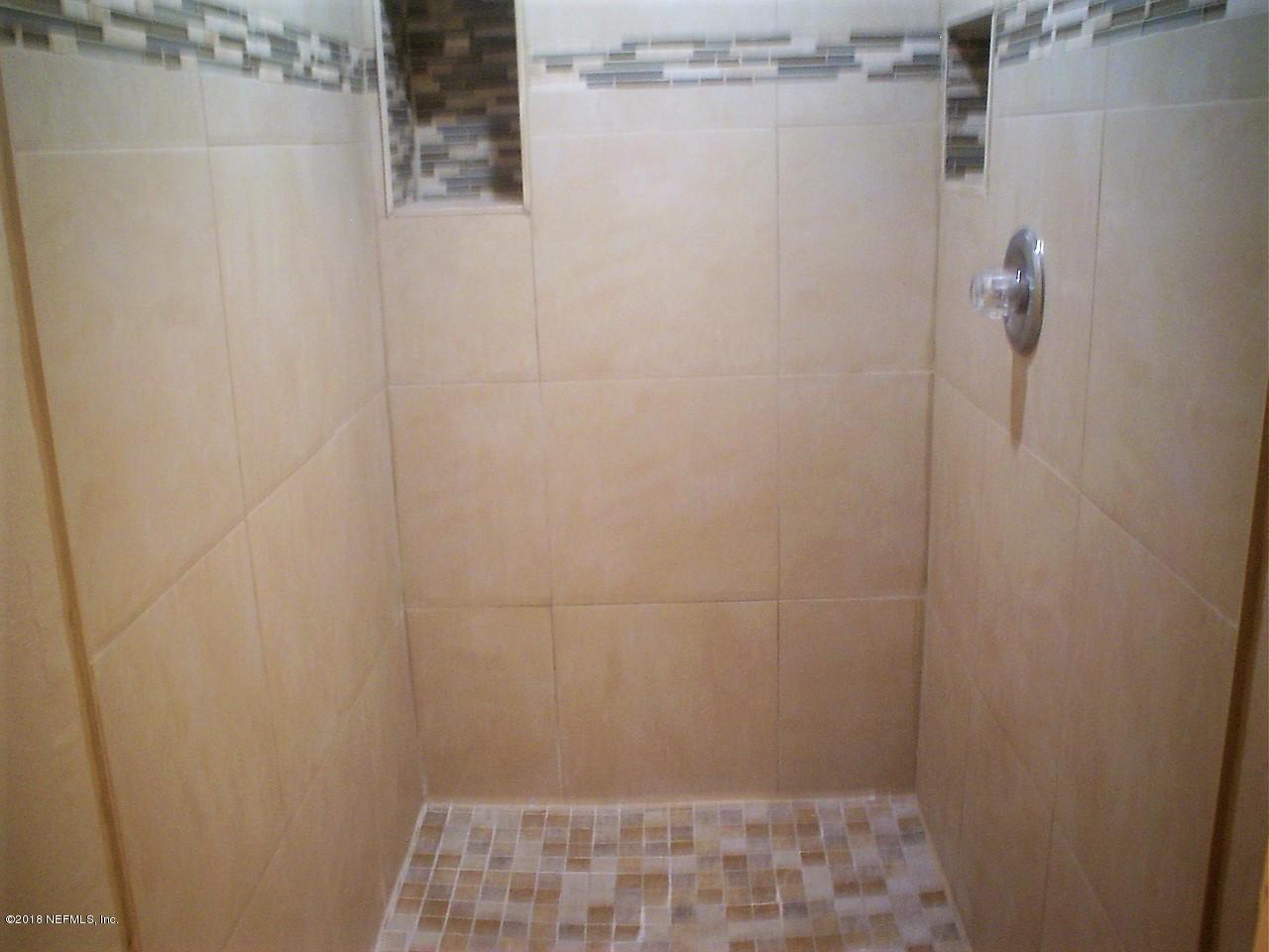 5260 Collins Road, Unit 102 Jacksonville, FL 32244 - Photo 7 of 11 Tiled shower