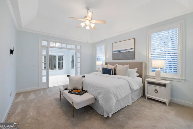 a spacious bedroom with a bed and window