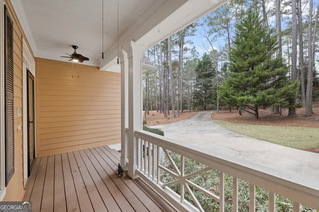 a view of a balcony with wooden floor
