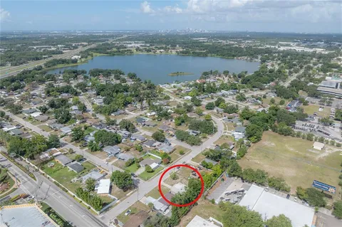 an aerial view of a house with a lake view