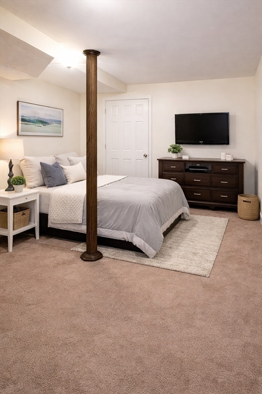 11 Seckel Street, Unit 1 Cambridge, MA 02141 - Photo 13 of 21 a spacious bedroom with a bed and flat screen tv