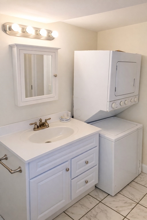 11 Seckel Street, Unit 1 Cambridge, MA 02141 - Photo 16 of 21 a bathroom with a sink and a mirror