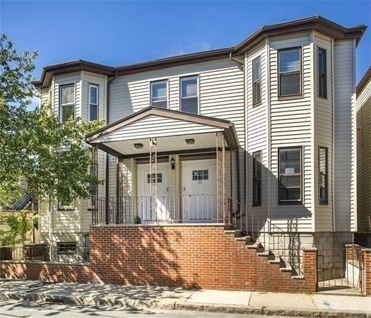 11 Seckel Street, Unit 1 Cambridge, MA 02141 - Photo 21 of 21 a front view of a house with a yard