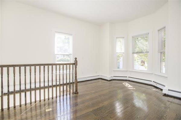 11 Seckel Street, Unit 1 Cambridge, MA 02141 - Photo 6 of 21 a view of an empty room with a window