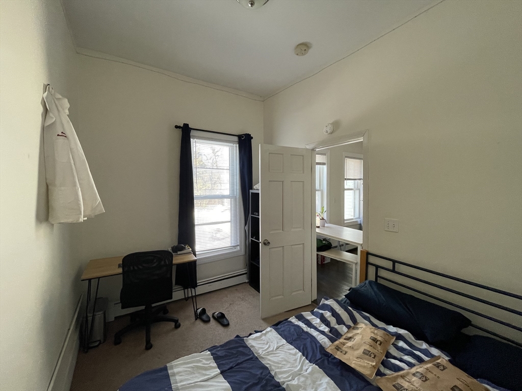 11 Seckel Street, Unit 1 Cambridge, MA 02141 - Photo 10 of 21 a room with furniture and a window