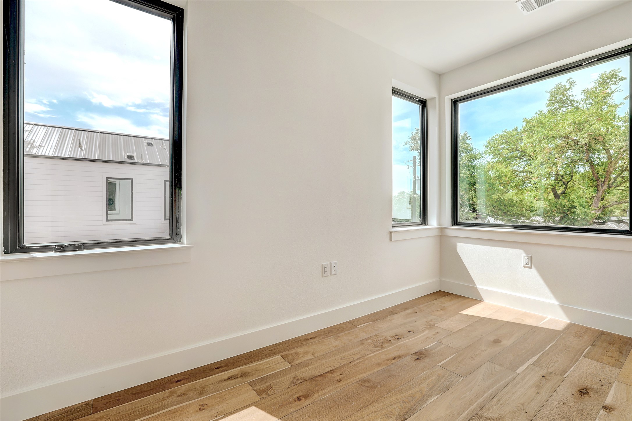 3208 Clawson Road, Unit 5A Austin, TX 78704 - Photo 21 of 34 Unfurnished room featuring light wood-style flooring and baseboards