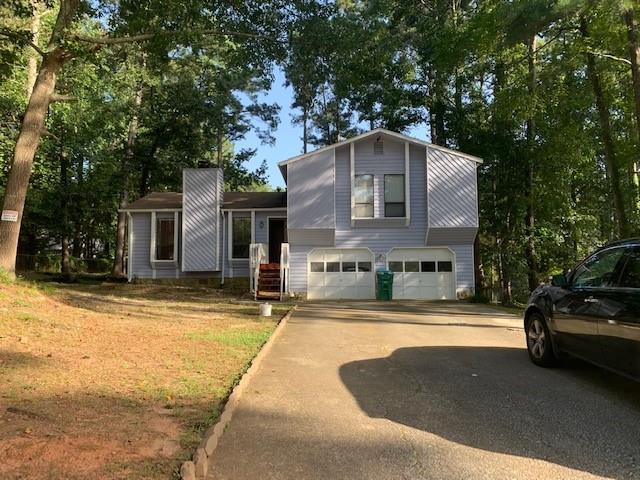 3794 Lamar Way Southwest Snellville, GA 30039 - Photo 1 of 1 a front view of a house with yard