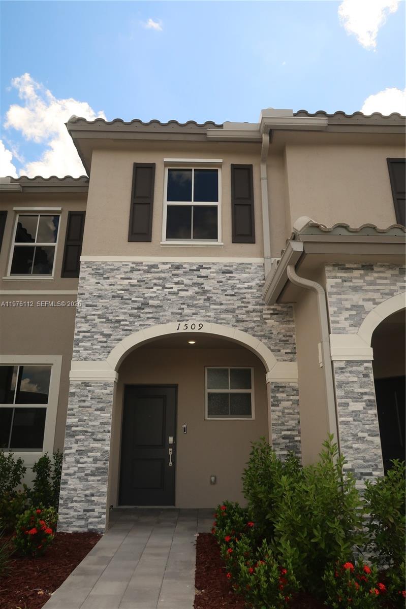 a front view of a house with windows